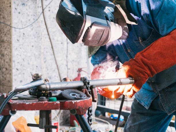 istock Iron soldering, Man working on iron soldering, welding sparks 1429840559