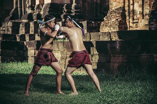 Two boxers fight with the martial arts of Muay Thai. Selective focus.