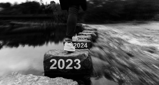 Woman crossing stepping stones with new year number 2023, 2024 and 2025 Woman crossing stepping stones with new year number 2023, 2024 and 2025 2024 30 stock pictures, royalty-free photos & images