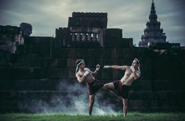 istock Two boxers fight with the martial arts of Muay Thai. 1429861237
