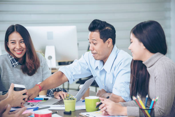 istock Creative design office center working teamwork. Happy business people partner plan strategy organization research people together at diversity office using laptop, smartphone company conference room 1429863216
