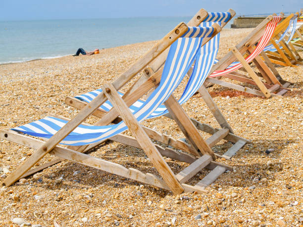 istock Brighton Beach and characteristic striped beach chairs in blue or red and white. 1429866578
