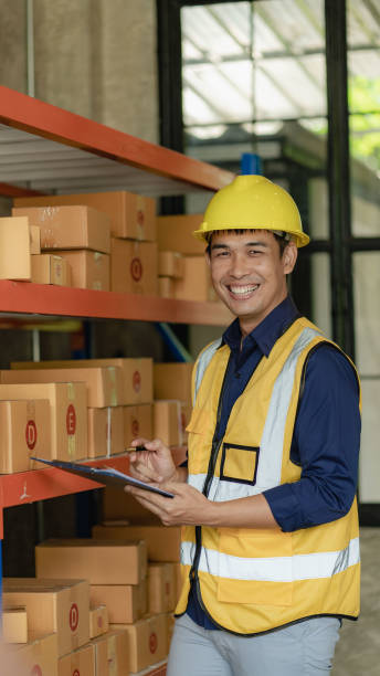 istock Asian man managing warehouse worker man holding tablet in warehouse Logistics network distribution and intelligent logistics, import, export, and industrial concepts..box transport 1429871960