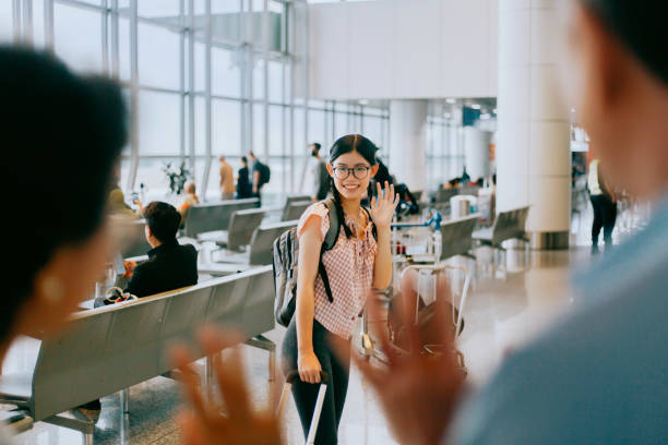 istock young girl saying good bye to parent before boarding 1429878065