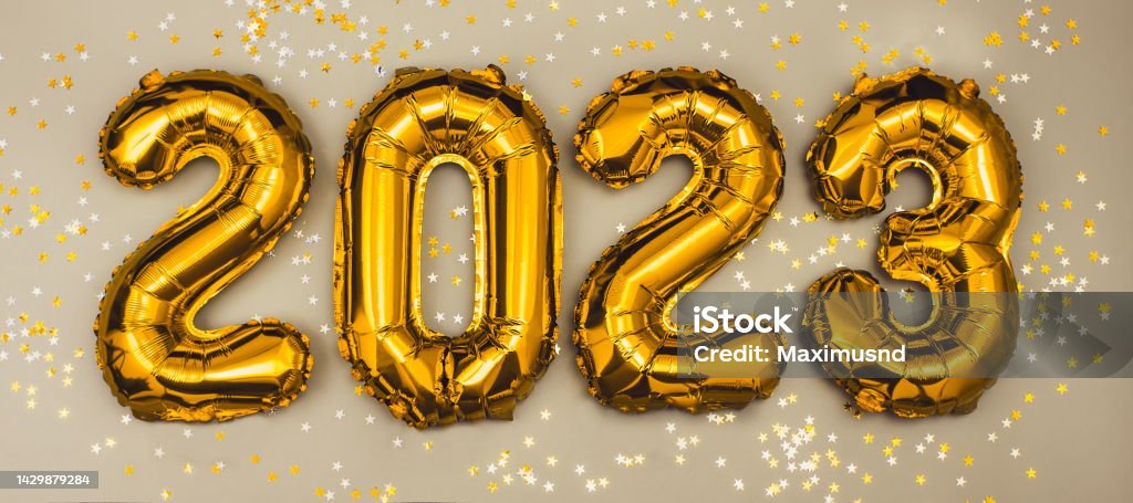 Happy New year 2023 celebration. Foil balloons numeral 2023 and with Glitter Stars .Flat lay 2023 Stock Photo