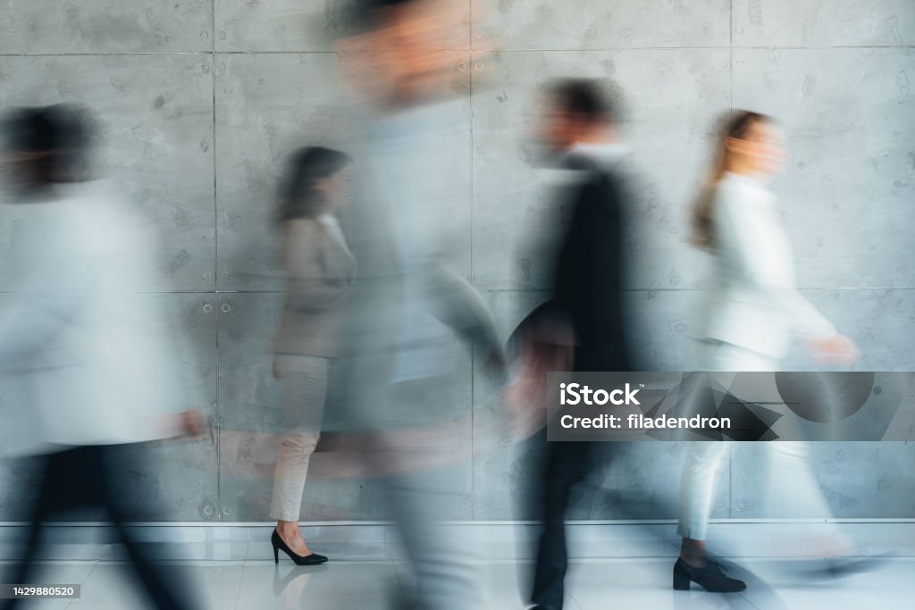 Place of work Busy modern workplace. Working process in the office, business people working, walking and talking, blurred motio Blurred Motion Stock Photo