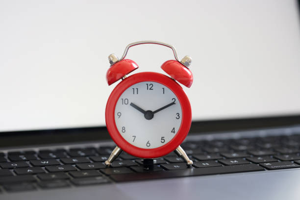 istock Red alarm clock for ten on laptop keyboard for business terms 1429886428