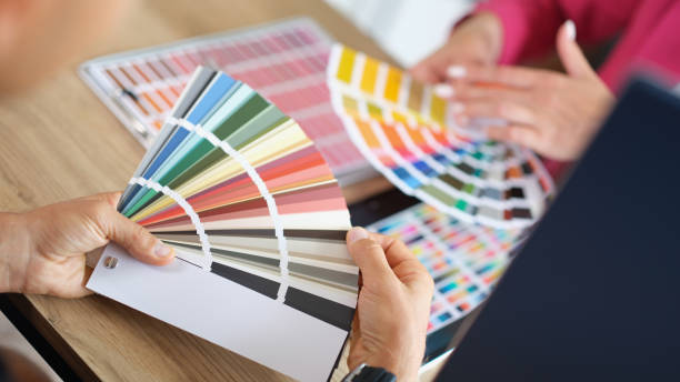 istock Creative designer advises client and shows color sample in color palette 1429886473