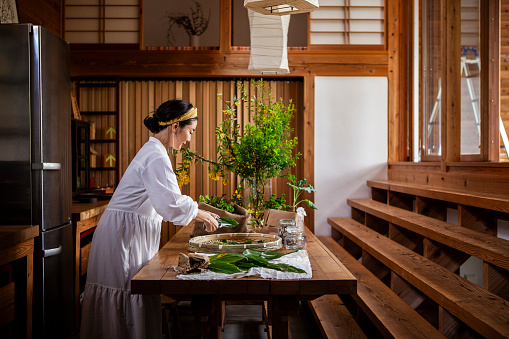 Sustainable lifestyle.
Woman cook on a wooden cooking table.