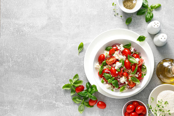 istock Salad with tomato, italian ricotta cheese and basil, top view 1429894384