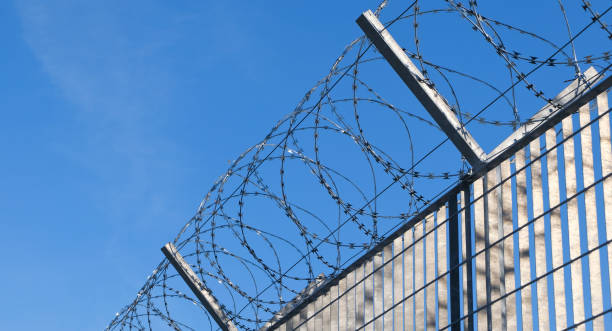istock The dangerous fence - Razor wire at the boarder 1429894518
