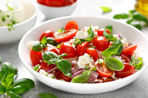 istock Salad with tomato, italian ricotta cheese and basil 1429894606