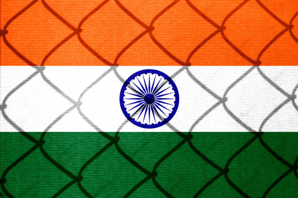 istock Backlight Backlight with actual Indian flag and barbed wire. Prison concept with border image. Double exposure hologram. 1429895389