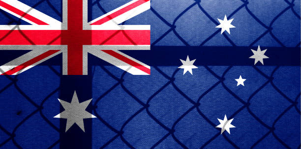 istock Backlight Backlight with actual Australian flag and barbed wire. Prison concept with border image. Double exposure hologram. 1429896734