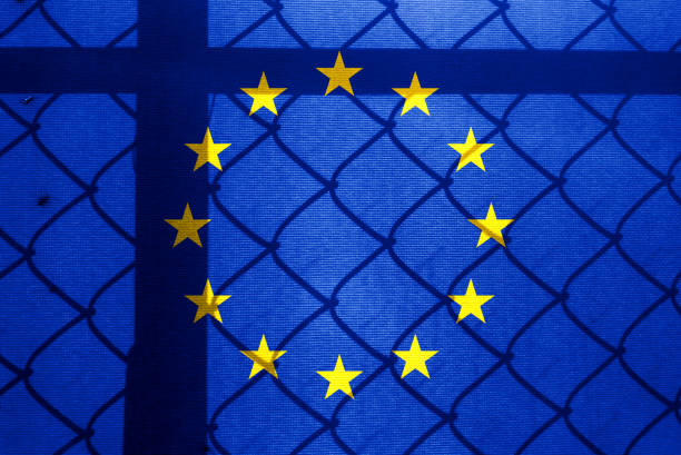 Backlight Backlight with actual EU flag and barbed wire. Prison concept with border image. Double exposure hologram.