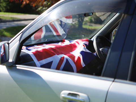 British flag in the car. The concept of national holidays