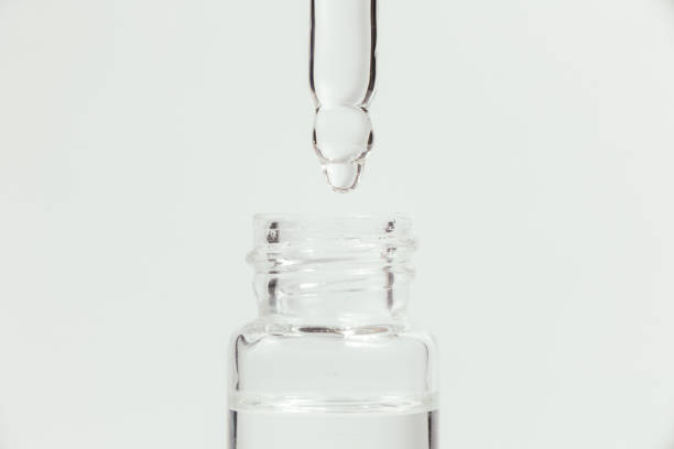 istock Pipette with a glass bottle on a light background. 1429902088