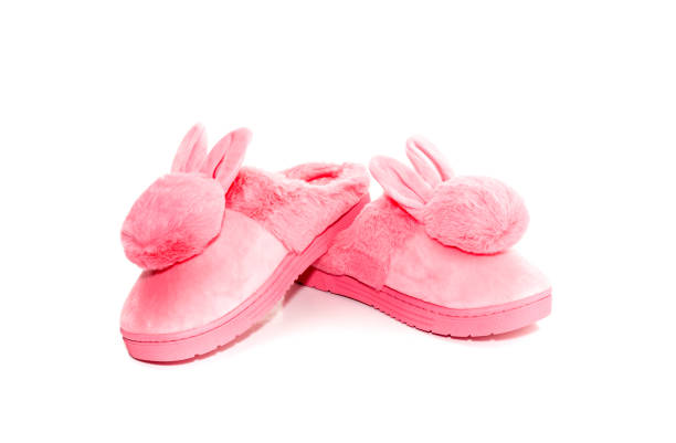 istock Pink female slippers on a white background 1429904061