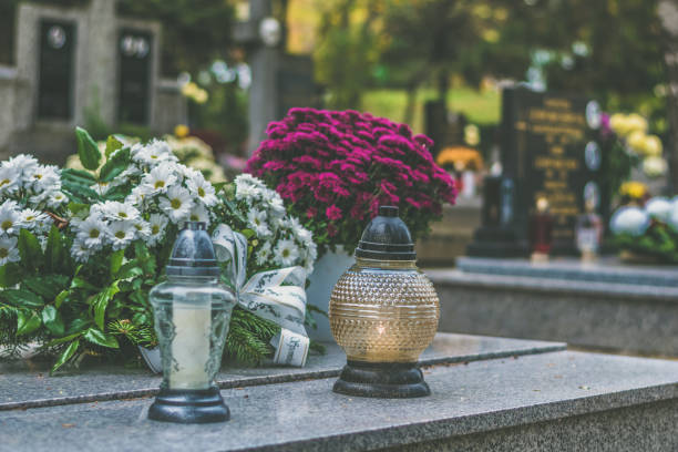 istock graves on cemetery during All Saints Day 1429905873