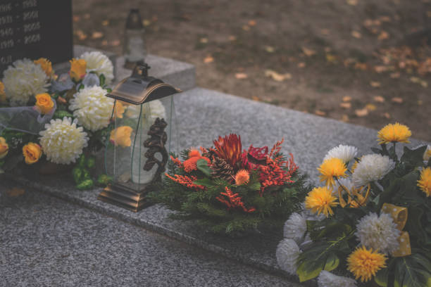 istock graves on cemetery during All Saints Day 1429905906