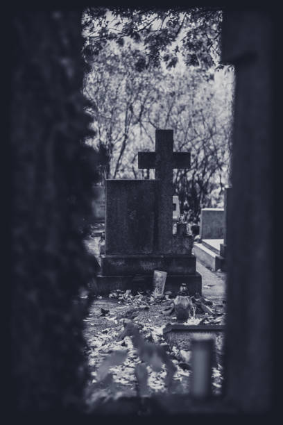 istock candle, cross, grave on cemetery, All Saints Day 1429906335