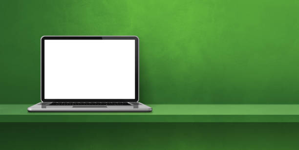 istock Laptop computer on green shelf background banner 1429912039