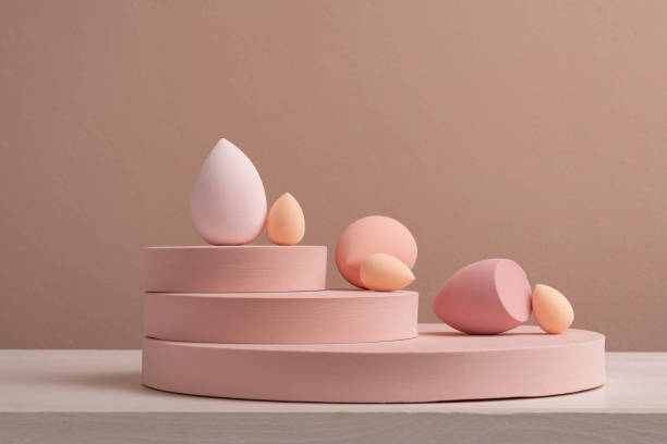 istock Makeup sponges on a round stand in pink tones. Cosmetic tools. 1429913845