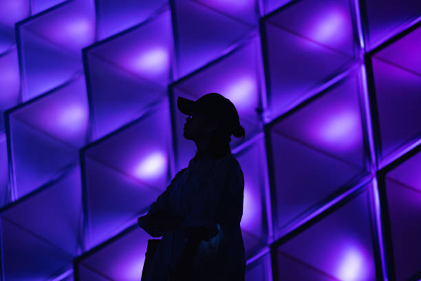 Lady silhouette on colorful lights background