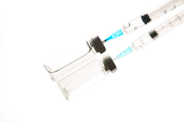istock Medical ampoules, infusion and syringe with injection 1429916155