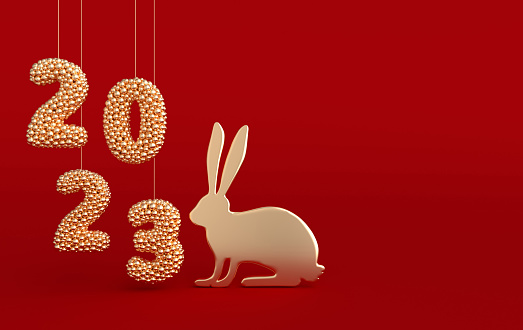 Rabbit zodiac sign and 2023 numerals on red background. Asian golden rabbit. Happy Chinese New Year 2023. 3d rendering