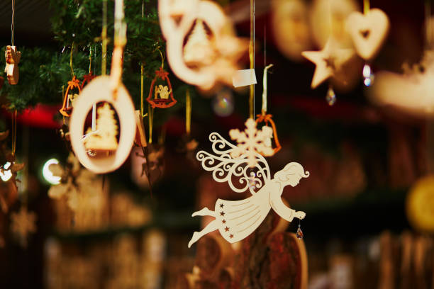 Wooden angel decoration on Christmas market stock photo