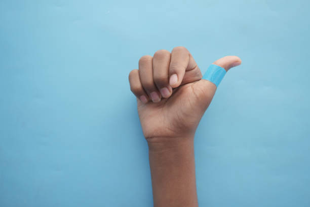 istock blue color adhesive bandage on hand 1429921650