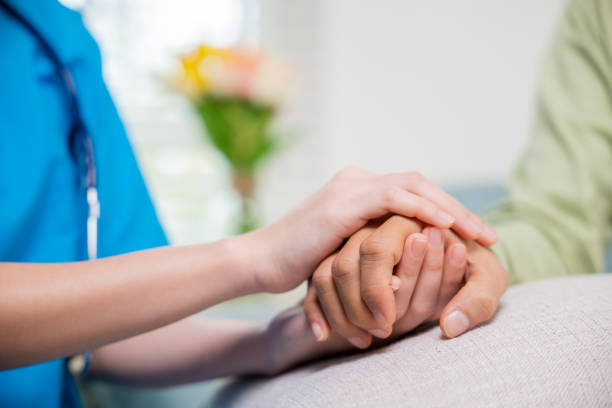istock Young woman helping hold hands offering her senior man 1429925162