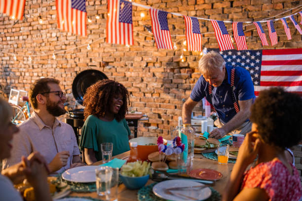 istock Multi-generation family having dinner outdoors on an American national holiday 1429927318