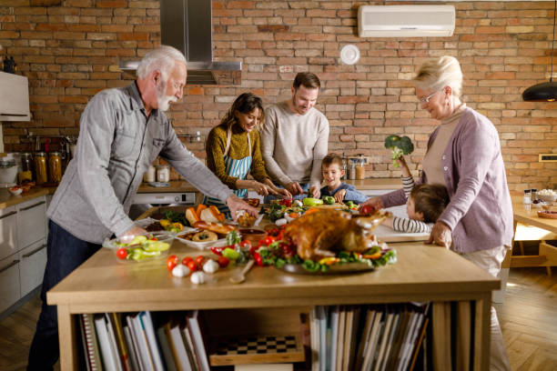 istock Happy multi-generation family making Thanksgiving lunch in the kitchen. 1429927595