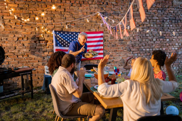 istock Multi-generation family having dinner outdoors on an American national holiday 1429928967