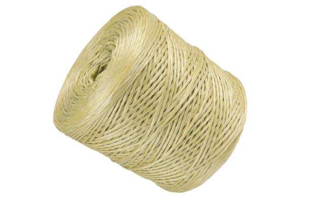 istock Coiled nylon rope isolated on white background. yellow rolled  striped nylon rope isolated. A coil of new colored rope. 1429929365