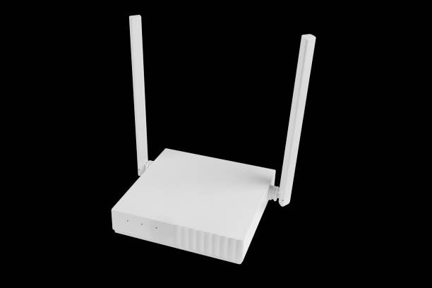 istock Wireless Wi-Fi router isolated on black background. wifi technology concept. White wireless internet router isolated. Cable modem with antenna isolated on black background. 1429931994