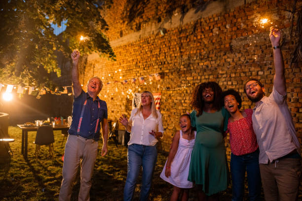 istock Multi-generation family watching an American holiday firework show from their back yard 1429934844