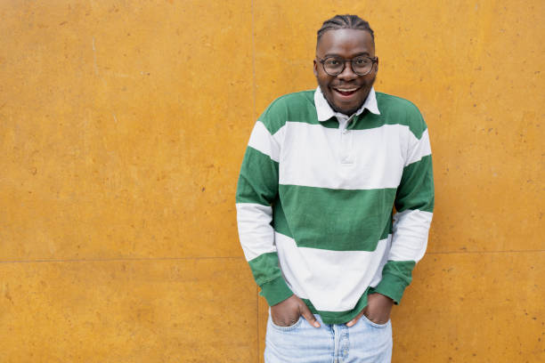istock Shy young man with hands in pockets 1429937430