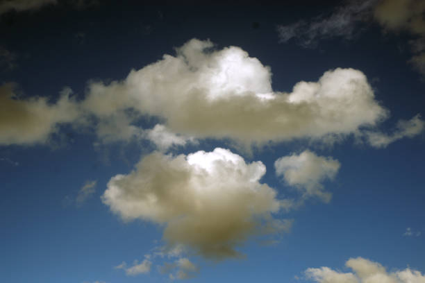 istock white clouds in front of the blue sky 1429938119