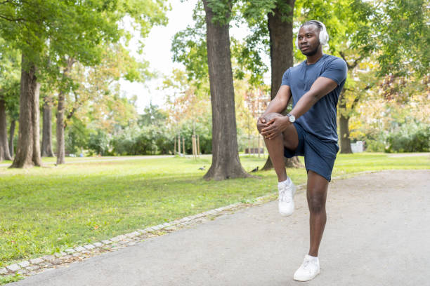 istock Athlete stretching legs and knees before working out 1429938157