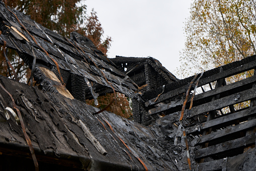 Burned house, war in ukraine. Damaged, house destroyed after fire and explosion