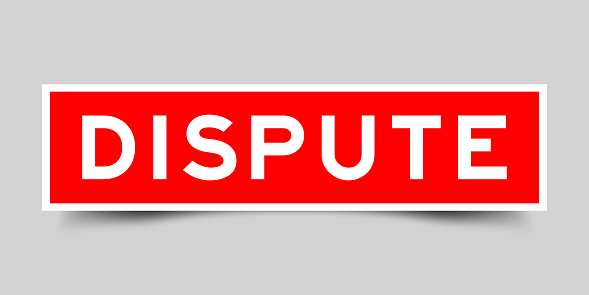 Sticker label with word dispute in red color on gray background