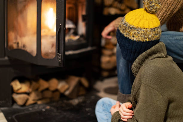 istock Father and son lighting fire to warm up 1429941048
