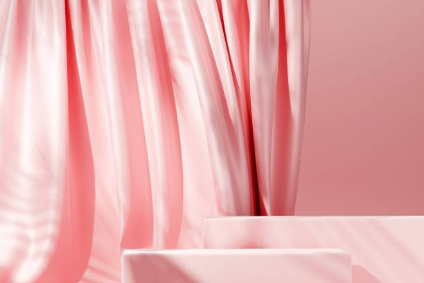 istock Pink pastel podium with pink flying fabric, cloth background 1429948271
