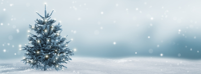 A snowy mountain landscape with a log cabin and a decorated Christmas tree lit by the light of a full moon. Santa is passing by in his sleigh.