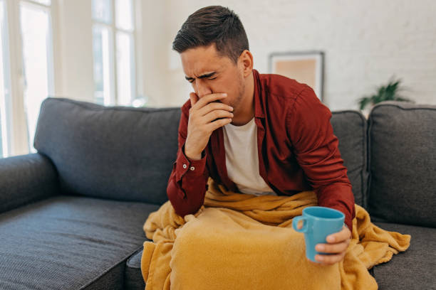 istock Unwell man coughing 1429950982