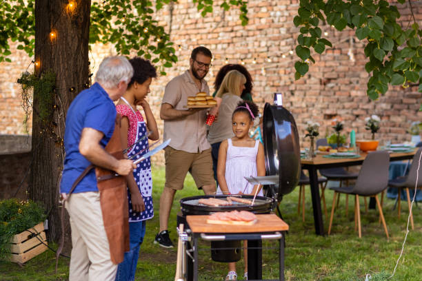 istock Multi-generation family at a back yard barbecue party 1429951646