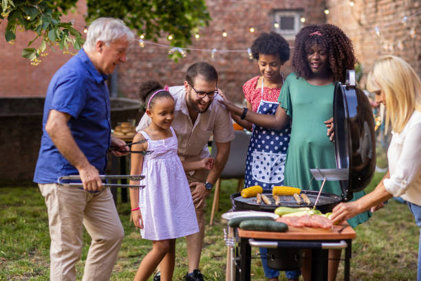 istock Family around the grill at a back yard barbecue party 1429951959